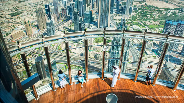 Visitors taking pictures at Burj Khalifa’s deck, Dubai’s most Instagrammable places.