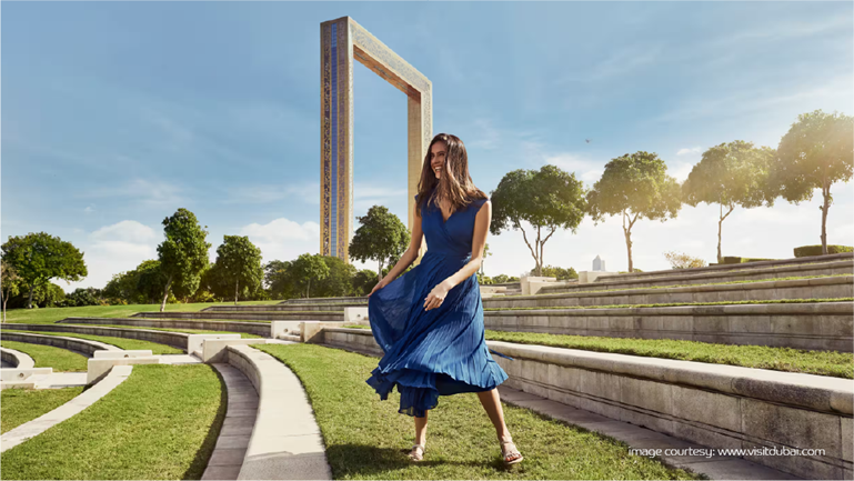 Woman enjoying Dubai Frame park, one of Dubai’s most Instagrammable places.