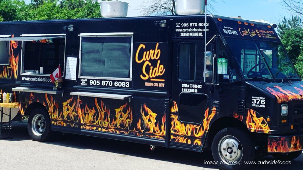 Curb Side food truck serving popular street eats in UAE.