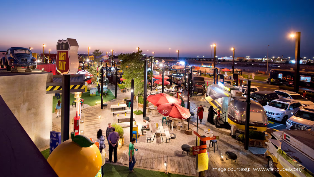 Vibrant night scene at Last Exit’s top food trucks in UAE.