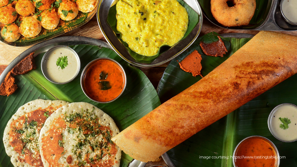 South Indian breakfast platter featuring masala dosa, fluffy idlis, and spicy sambhar.